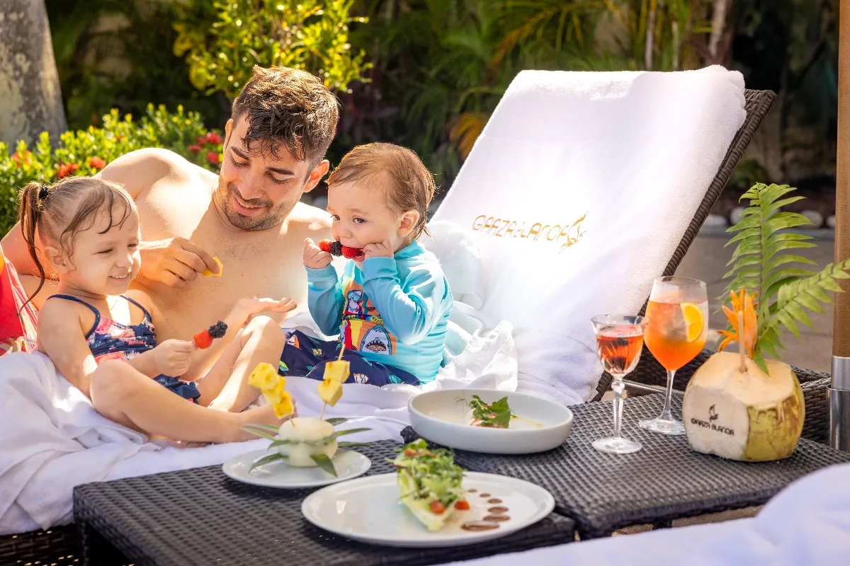 Family having fun at the pool at Garza Blanca Puerto Vallarta