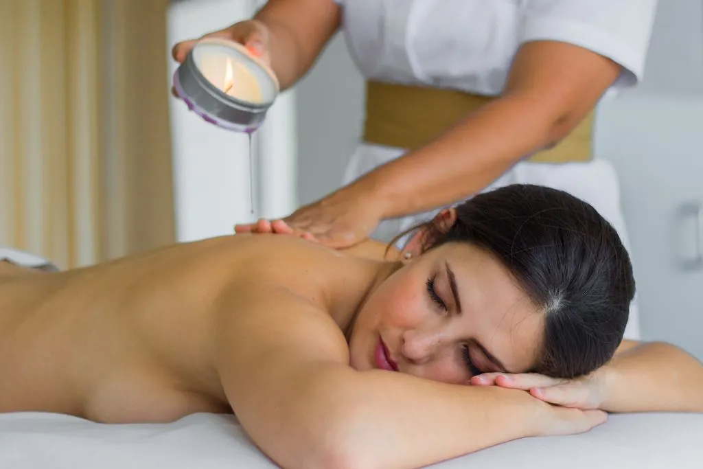 Woman enjoying a relaxing massage session at Spa Imagine Puerto Vallarta